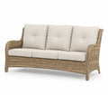 Rattanowa sofa z kremowymi poduszkami 200 cm